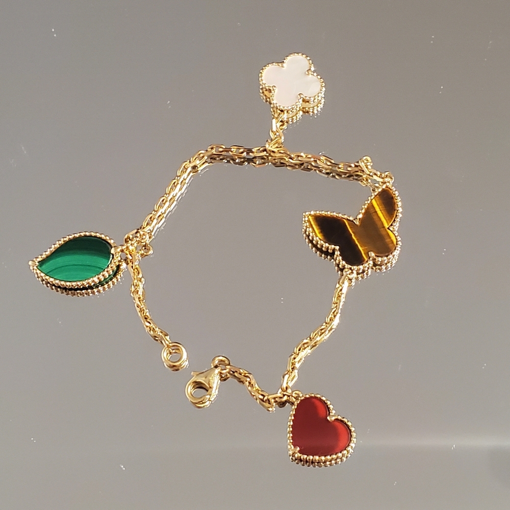 VAN CLEEF & ARPELS
18K Yellow/ Gold Lucky Alhambra